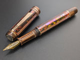 Carina Ragazzone in Root Beer and Copper Striped Awabi w/ Chocolate Pearl Resin